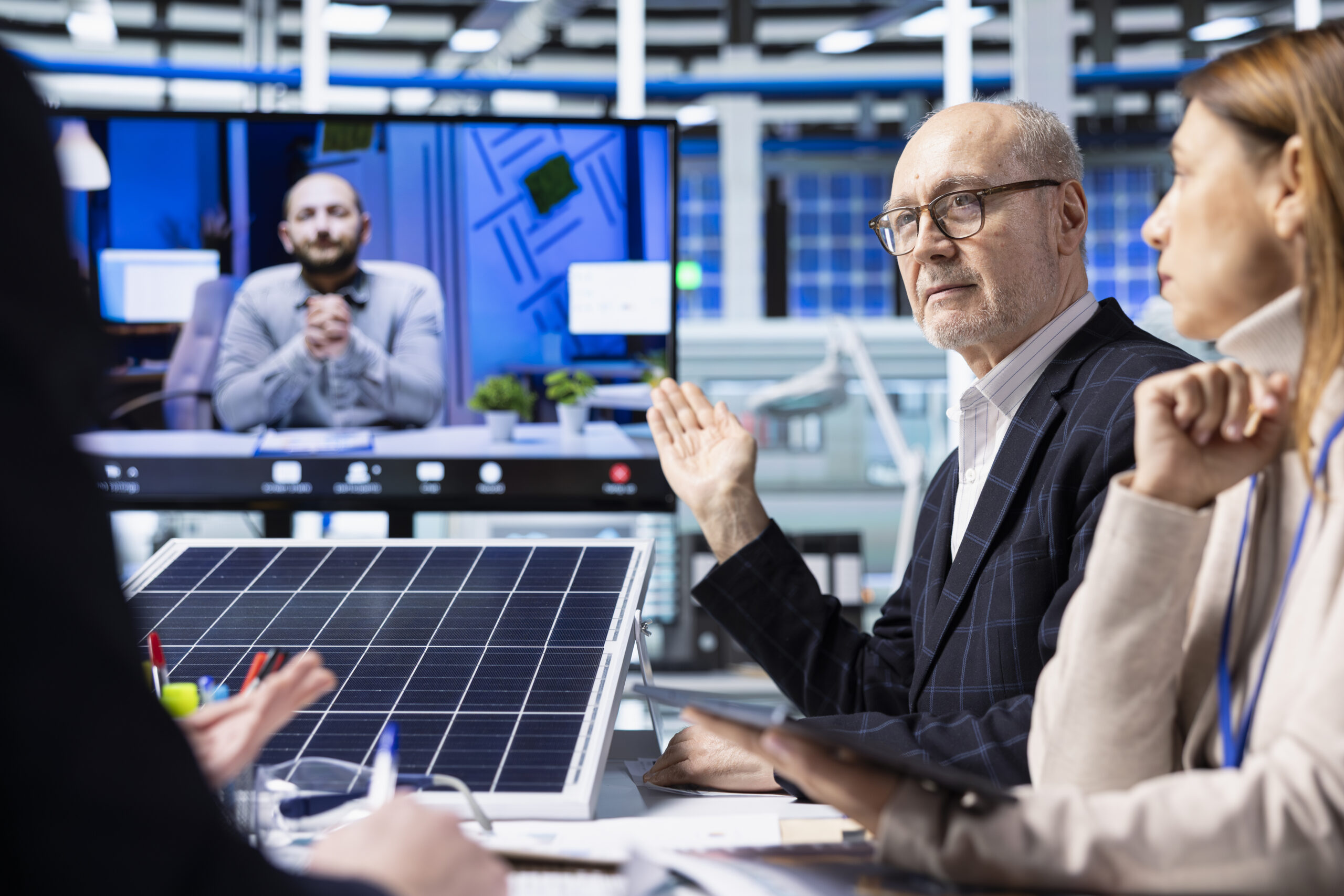 factory managers talk about new photovoltaics materials in internet videocall